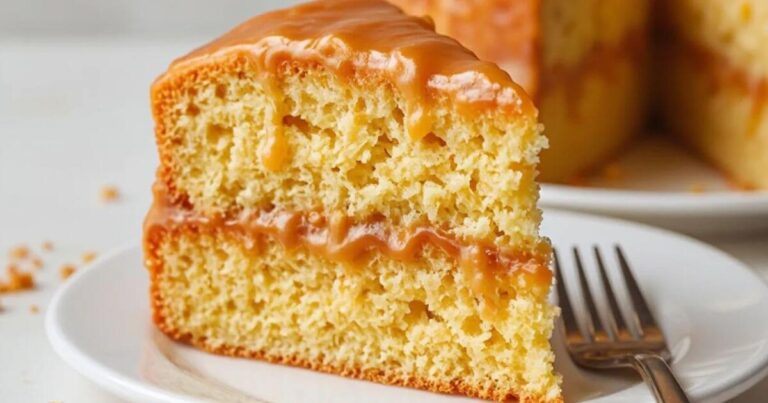 One-bowl slice caramel cake topped with rich caramel glaze on a white plate