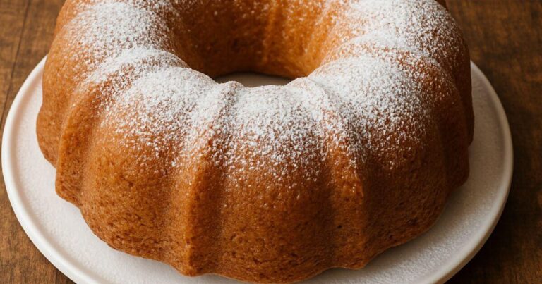 Rich and nutty butter pecan pound cake recipe freshly baked and garnished with toasted pecans, perfect for a quick 60-minute dessert recipe.
