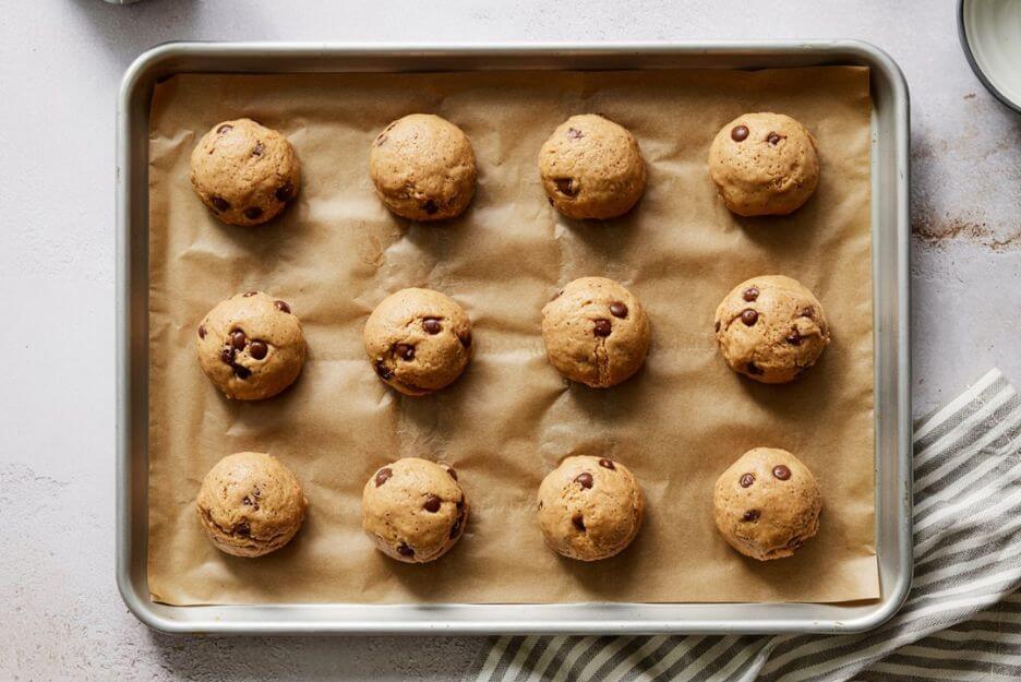 Scoop rounded tablespoons of dough onto the baking sheets, spacing them about 2 inches apart.