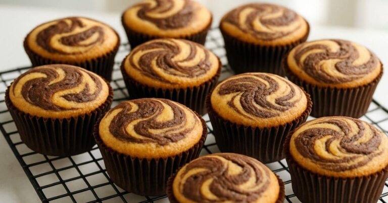 Delicious marble cupcakes with a moist, fluffy texture, decorated with a light swirl pattern.