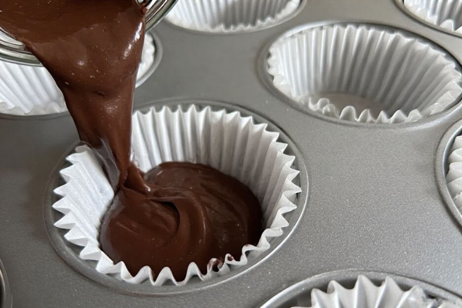 Divide the batter evenly among the liners
