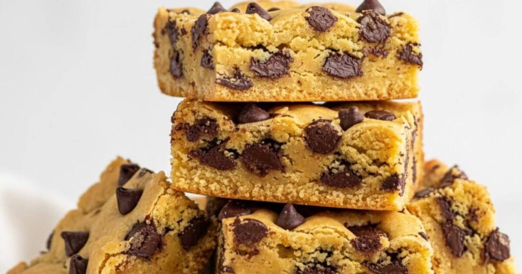 Stack of soft chocolate chip bar cookies made from cake mix, featuring dark chocolate chunks and chips.