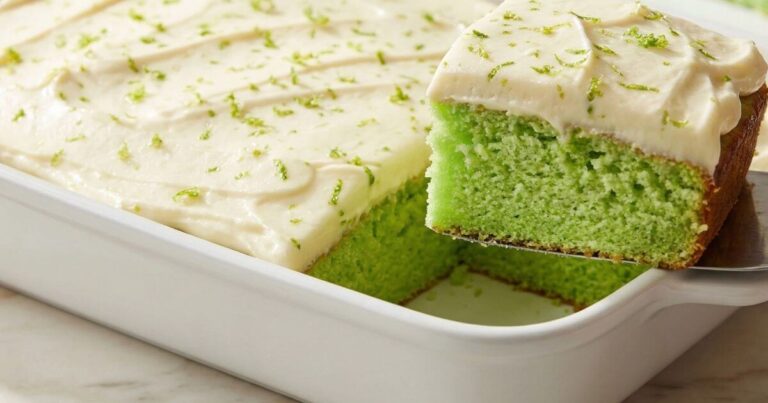 Key Lime Cake Recipe easy zesty super moist green cake with white cream cheese frosting in baking dish