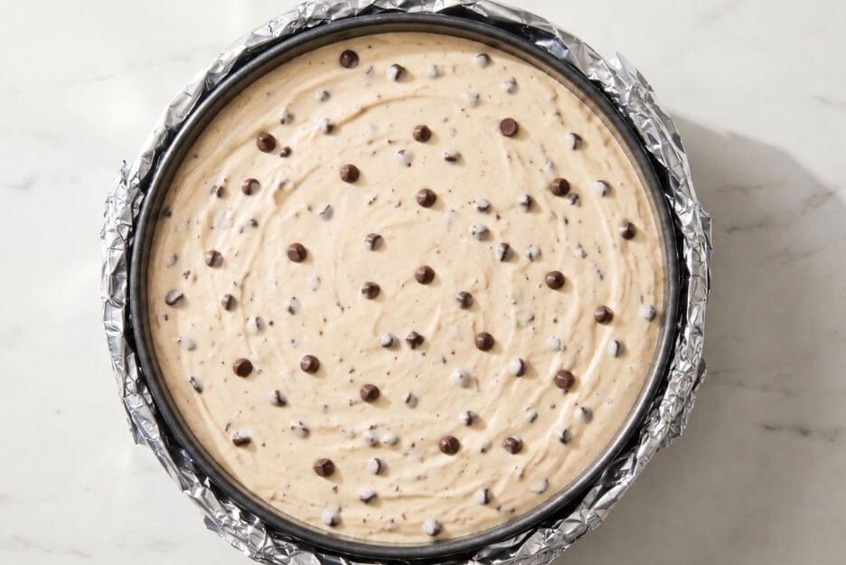 Pour the filling over the cooled crust and smooth the top