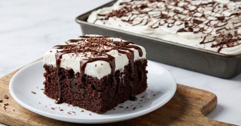 Chocolate poke cake for chocolate lovers topped with whipped cream and chocolate drizzle
